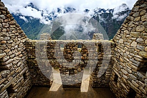 Sunshine view of Machupicchu stone anchient walls and temple among mountains