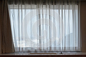 sunshire light looking pass Translucent white fabric curtains an
