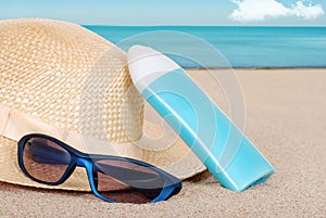 Suntan lotion hat focus on sun glasses