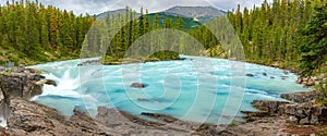 Sunwapta Falls with blue water flowing in Spring, Alberta, Canada