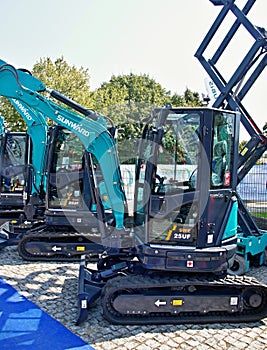 Sunward mini excavators displayed at outdoor construction exhibition