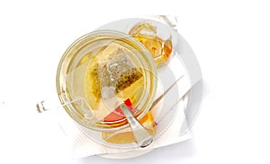 suo of tea, honey and lemon on white