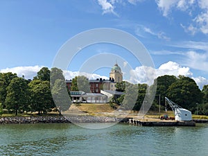 Suomenlinna, Sveaborg sea fortress and top of Kirkko church seen from boat cruise