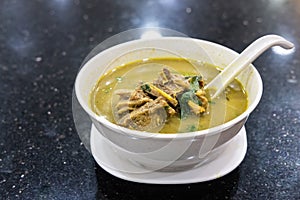 Sup Kambing, or mutton soup, popular soup at mamak restaurant photo