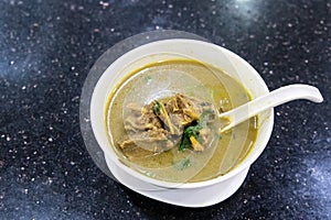 Sup Kambing, or mutton soup, popular soup at mamak restaurant photo