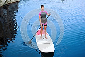 SUP Stand up paddle board woman paddleboarding