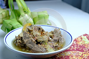 Sup Tulang - is the Malaysian version of bone broths on white bowl delicious photo