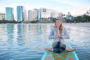 SUP Yoga practice early morning in Waikiki photo