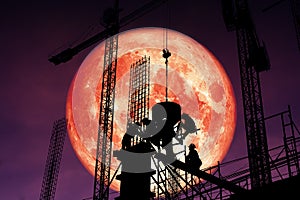 super blood moon back silhouette worker on construction night sk