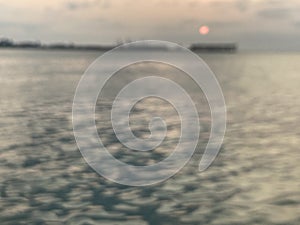 super blurred photography of sunset at the port and dark black sea