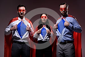 super businesspeople in masks and capes showing blue shirts