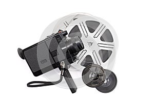 Super 8 camera and film reels isolated on white background