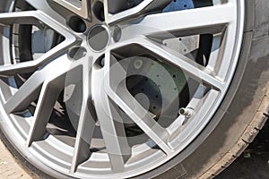 Super car disc brake. Car wheels. steel alloy car disks background template for design work. Car alloy wheel. Close-up shot of a