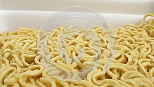 Super close details of dry instant noodles. background texture