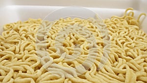 Super close details of dry instant noodles. background texture