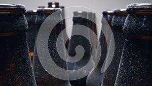 Super close up, rows of empty dusty brown glass bottles