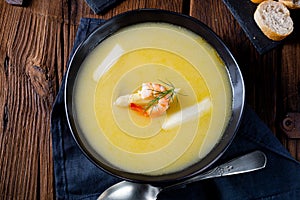 A Super delicious asparagus soup with crab and capers photo