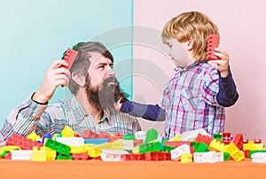Super father. building home with colorful constructor. happy family leisure. child development. small boy with dad