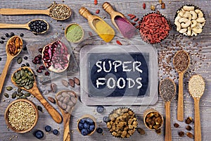 Super foods in spoons and bowls