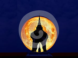 super full blood moon back of silhouette bell tower