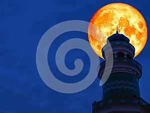 super full blood moon back top of mosque clear night sky