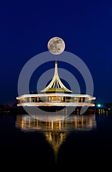 Super full moon over a beautiful building