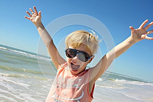 Super Happy Boy on Beach by Ocean