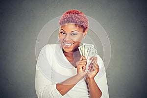 Super happy excited successful woman holding money dollar bills in hand
