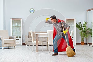 The super hero cleaner working at home