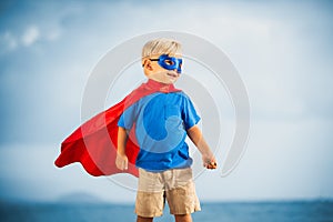 Super Hero kid with a mask flying