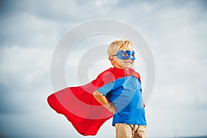 Super Hero kid with a mask flying photo