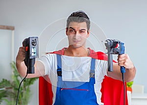 Super hero repairman working at home