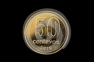 Argentine Gold Fifty Centavo Coin Isolated On Black photo