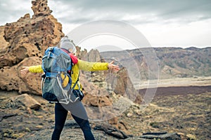 Super mom with baby boy hiking in backpack