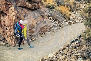 Super Mom with baby boy hiking in backpack