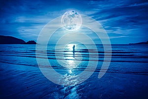 Super moon. Colorful blue sky with cloud and bright full moon over seascape