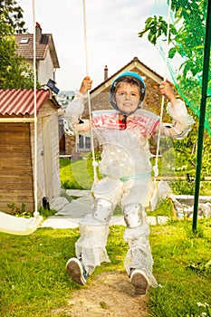 Super safe child in bubble wrap swing on swings