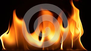 Super slow motion of abstract fire flames isolated on black background burning