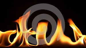 Super slow motion of abstract fire flames isolated on black background burning