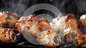 Super slow motion Chicken legs are fried in a pan