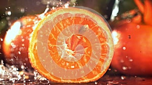 Super slow motion fresh tangerines