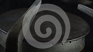 Super slow motion of a lit gas stove top