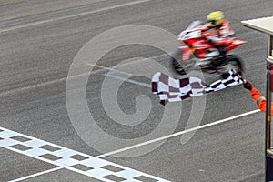 Super sport motorcycle crossing the finish line