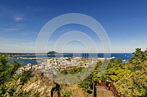 Super view from mountain-top while down from top of Seongsun Ilchubong, jeju, South Korea. The top of the mountain is at one