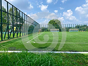 Super wide angle view of open spacious futsal field in HDB heartland in Singapore. Community football pitches in local