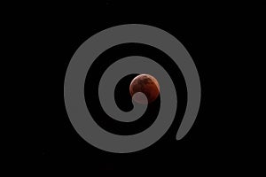 Super wolf blood moon lunar eclipse at full eclipse, red stage