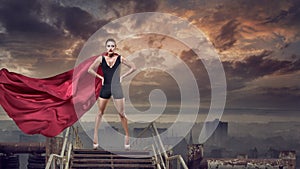 Super woman with red cape photo