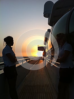 Super yacht sunset with crew