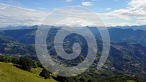 Superb 360Â° landscape on the Padana plain and Alps in summer time. Panorama from Linzone Mountain, Bergamo, Italy.