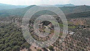 Superb aerial view of vineyards and orchards in Italy.